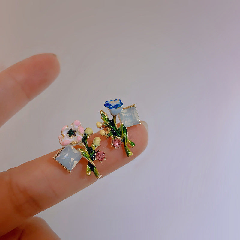 Asymmetrical Floral Creativity with a Painted Forest Aesthetic Earrings
